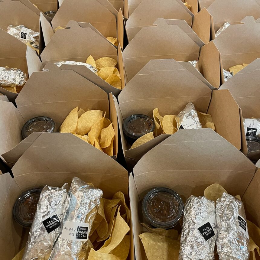 Individually packaged Catered Buddha Box Lunches. Two tacos and a side of chips and salsa